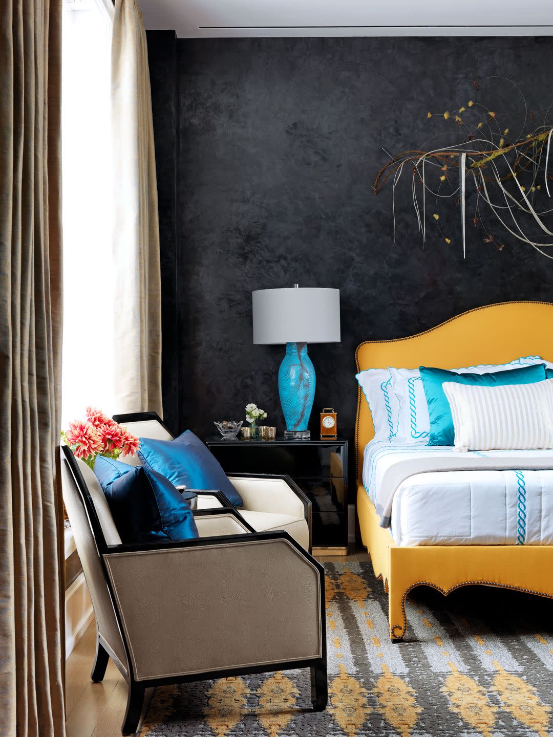 Yellow bed in black bedroom