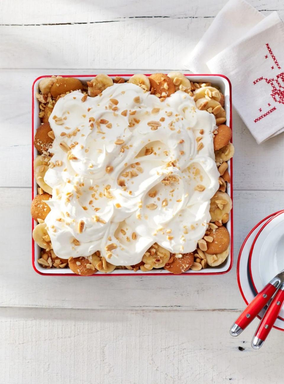 salty peanut banana pudding in a red rimmed serving dish