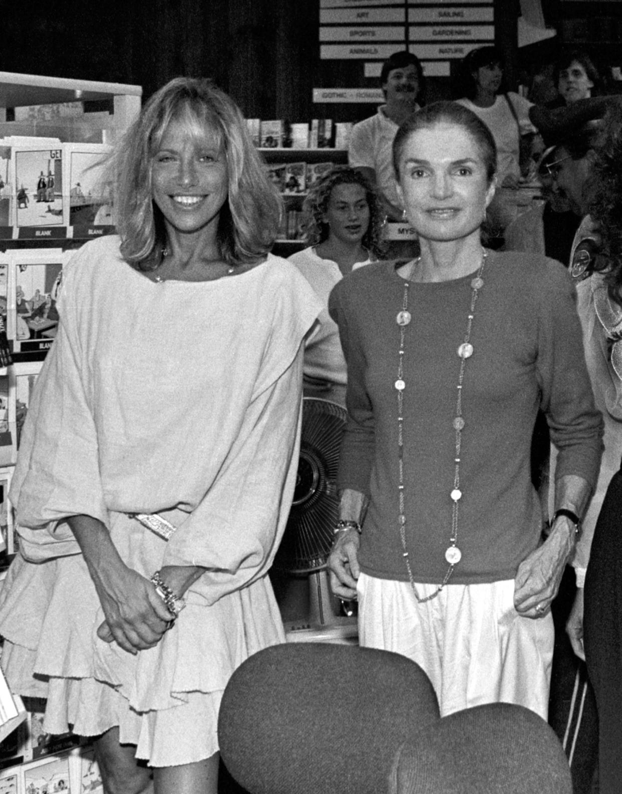 Good friends Carly Simon and Jackie Onassis pose for a picture at Bunch of Grapes Bookstore on Martha's Vineyard, Massachusetts, 9/2/89.   Photo by Stephen Rose   (Photo by Stephen Rose/Getty Images)