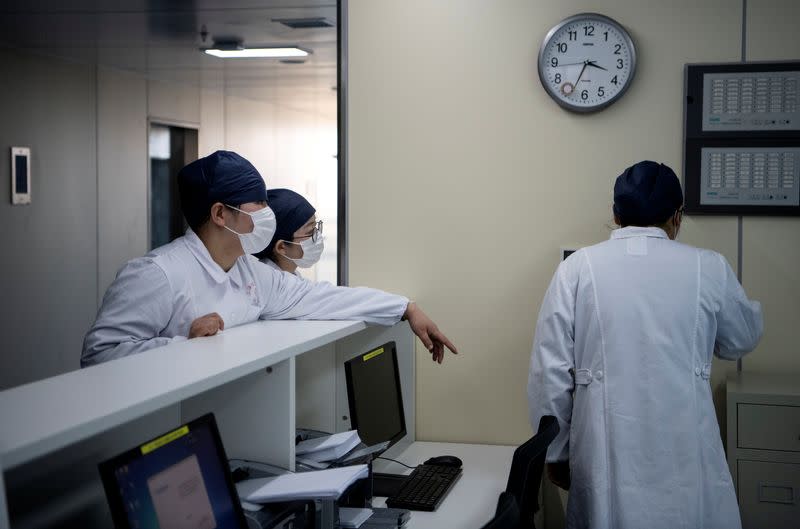 The nurses talk inside finished but still unused building A2 of the Shanghai Public Clinical Center, following the outbreak of the new coronavirus, in Shanghai