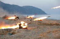 <p>A view of a firing contest among multiple launch rocket system (MLRS) batteries selected from large combined units of the KPA, Dec. 21, 2016. (KCNA/Reuters) </p>