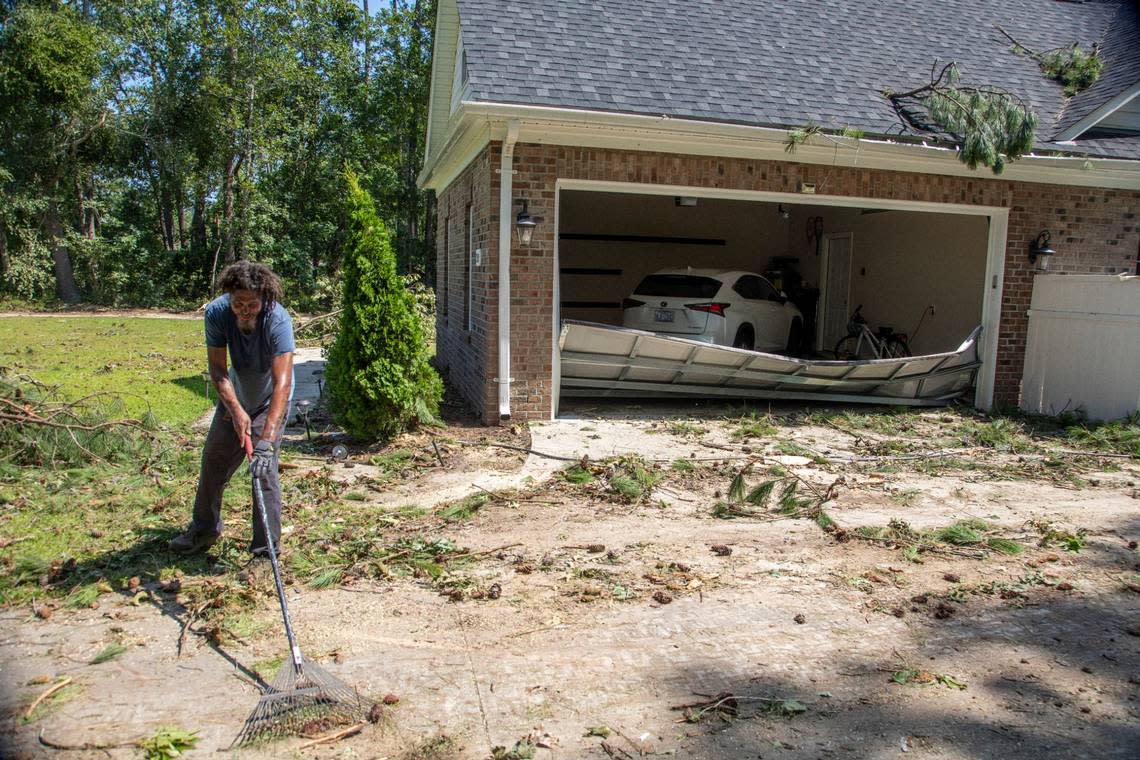 Antonio Middleton of Nashville helps clean up at a damaged home on Great Glen in the Belmont Lakes Country Club community in Rocky Mount Thursday, July 20, 2023. An EF3, tornado with wind speeds of 150 mph touched down in Nash County Wednesday around 12:30 p.m. Wednesday according to the Raleigh National Weather Service.. Travis Long/tlong@newsobserver.com