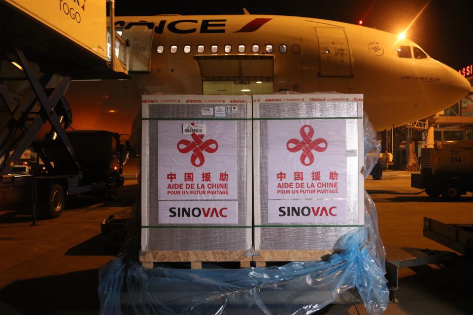 A batch of Sinovac vaccine donated by China is seen at the Gnassingbe Eyadema International Airport in Lome, Togo, Aug. 20, 2021. Togo has received the second batch of Sinovac vaccines donated by China, as part of the cooperation between the two countries to fight against the upsurge of COVID-19 cases. (Photo by Tian Yun/Xinhua via Getty Images)