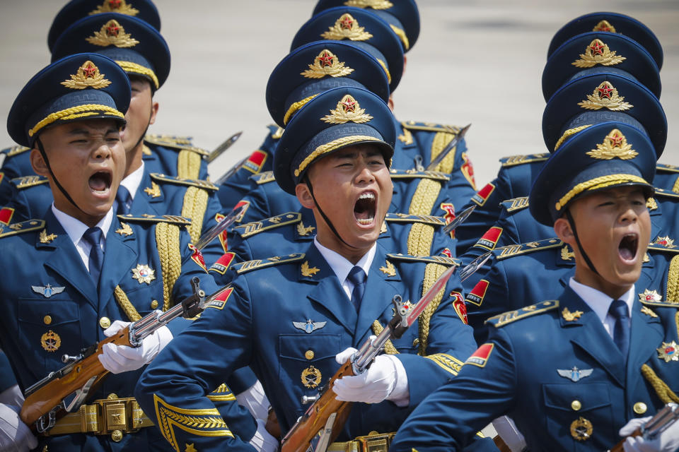 Members of a Chinese honor guard march in formation during a welcoming ceremony for Russian Prime Minister Mikhail Mishustin in Beijing, China, Wednesday, May 24, 2023. (Thomas Peter/Pool Photo via AP)