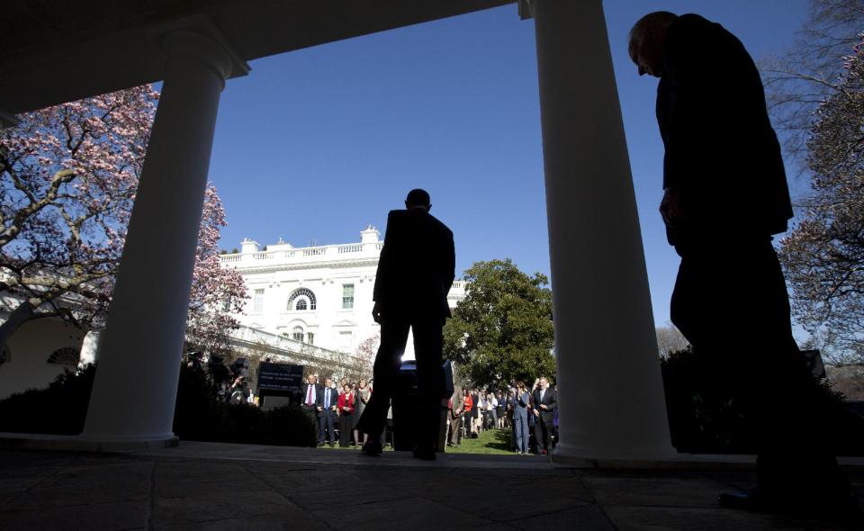 President Barack Obama, followed Vice President Joe Biden, arrives speak in the Rose Garden of the White House in Washington, Tuesday, April 1, 2014, about the Affordable Care Act. The deadline to sign up for health insurance under the Affordable Care Act passed at midnight Monday night. (AP Photo/Carolyn Kaster)