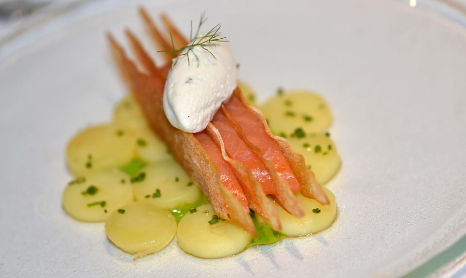 Marinated salmon in between paper thin slice baguette, fingerling potatoes topped with creme fraiche and dill paired with a glass of sauvignon blanc. Maison Blanche is located at 2605 Gulf of Mexico Dr. on Longboat Key. Photographed Friday July 17, 2020.