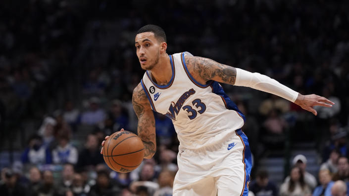 Washington Wizards forward Kyle Kuzma (33) dribbles during the second half of an NBA basketball game against the Dallas Mavericks in Dallas, Tuesday, Jan. 24, 2023. The Wizards won 127-126. (AP Photo/LM Otero)