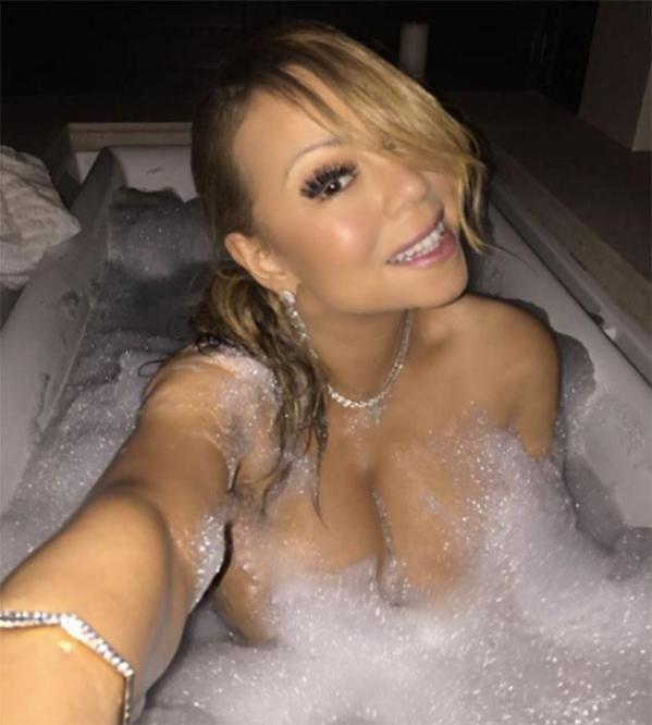 Mariah Carey nearly bares all with naked bath selfies