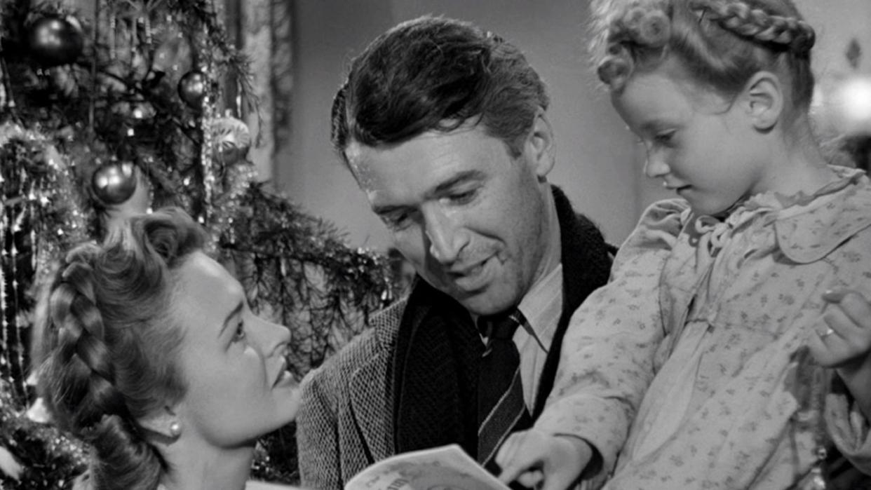  James Stewart, Donna Reed, and Karolyn Grimes in It's A Wonderful Life. 