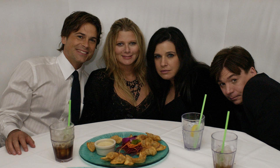 Rob Lowe and his wife Sheryl, left, along with Mike Myers and his wife Robin pose for a photograph at the Entertainment Tonight Emmy Party in Los Angeles on Sunday, Sept. 21, 2003. (AP Photo/Laura Rauch)