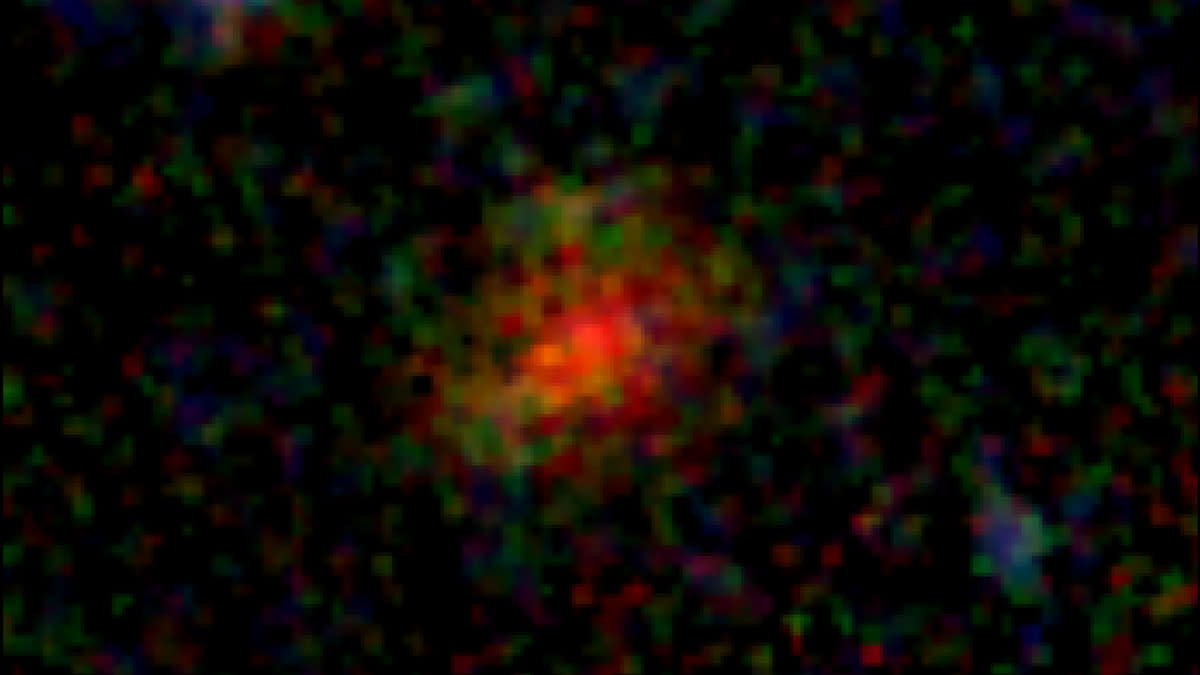  A blurry, pixelated red and green splotch dissipates outward to black. 