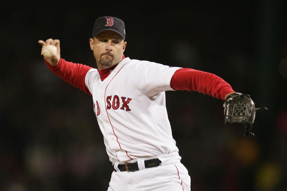 BOSTON - OCTOBER 23:  Pitcher Tim Wakefield #49 of the Boston Red Sox throws a pitch against the St. Louis Cardinals in the first inning during game one of the World Series on October 23, 2004 at Fenway Park in Boston, Massachusetts. (Photo by Al Bello/Getty Images)