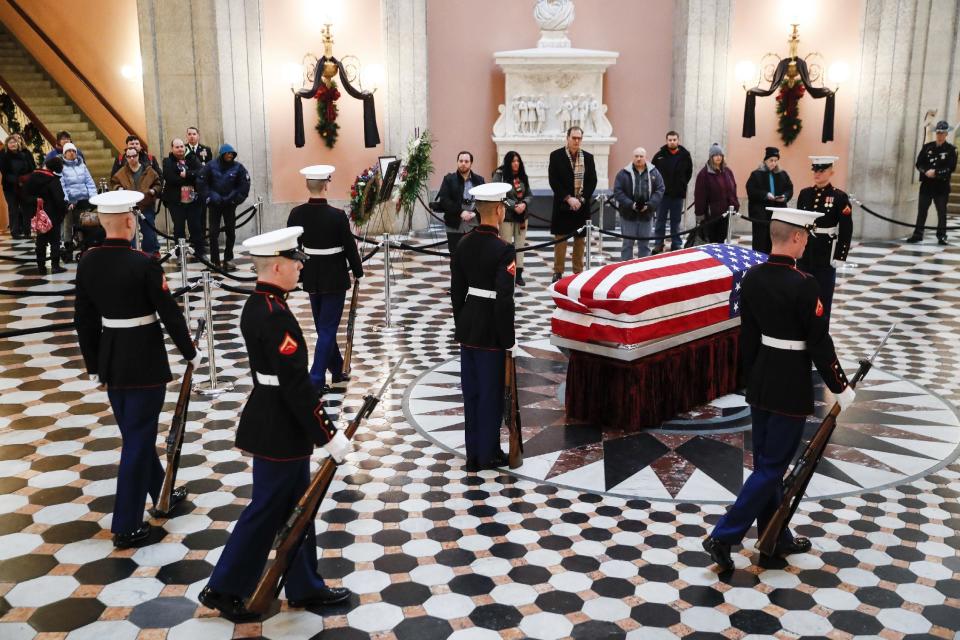 Marines stand guard at the casket of John Glenn, Friday, Dec. 16, 2016, in Columbus, Ohio. Glenn's home state and the nation began saying goodbye to the famed astronaut who died last week at the age of 95. (AP Photo/John Minchillo)
