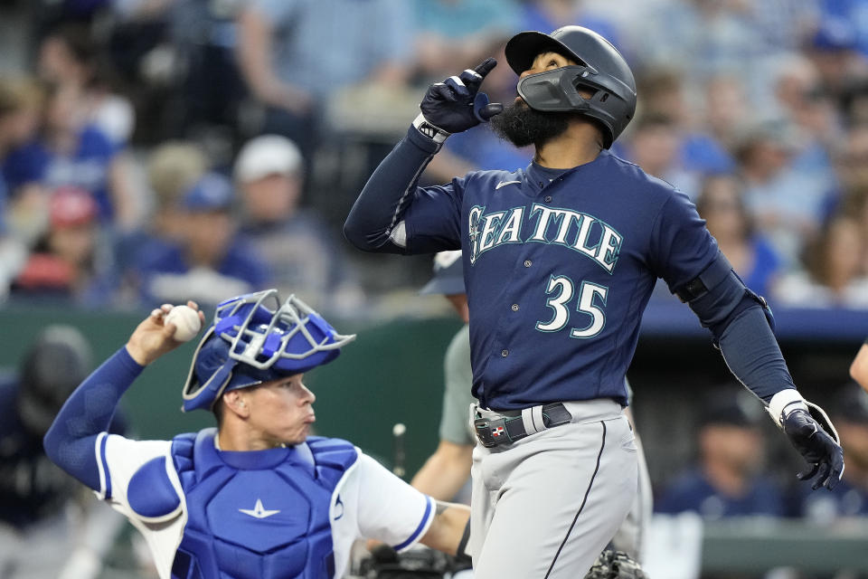 Seattle Mariners' Teoscar Hernandez (35) celebrates as he crosses the plate after hitting a two-run home run during the fourth inning of a baseball game against the Kansas City Royals Tuesday, Aug. 15, 2023, in Kansas City, Mo. (AP Photo/Charlie Riedel)