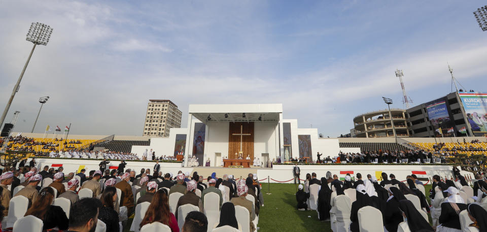 Pope Francis celebrates mass at the Franso Hariri Stadium in Irbil, Kurdistan Region of Iraq, Sunday, March 7, 2021. The Vatican and the pope have frequently insisted on the need to preserve Iraq's ancient Christian communities and create the security, economic and social conditions for those who have left to return.(AP Photo/Andrew Medichini)