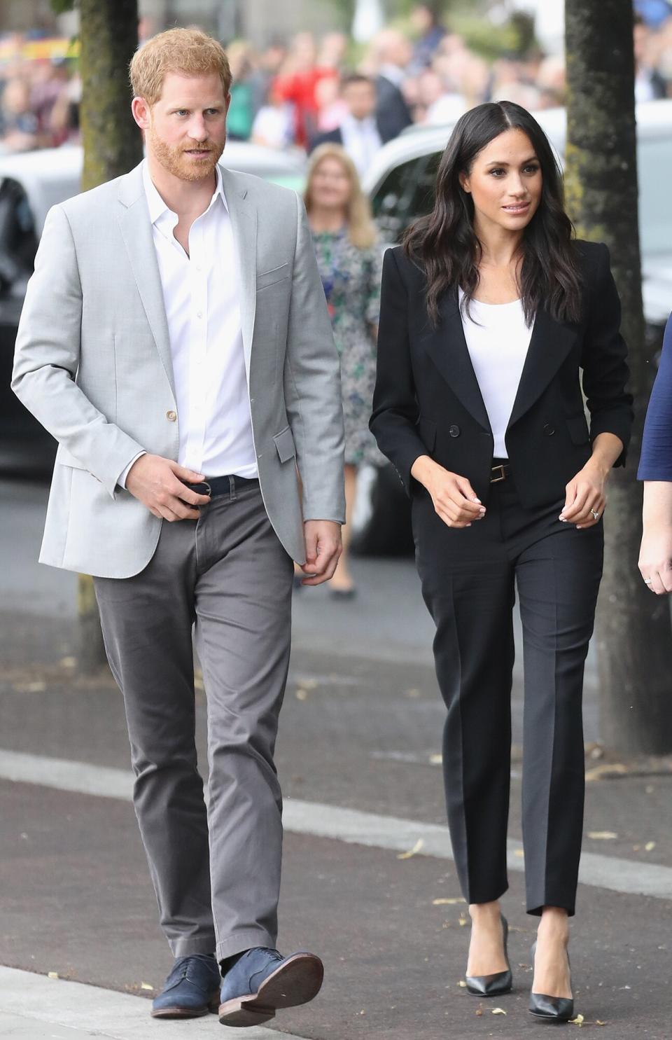 Prince Harry, Duke of Sussex and Meghan, Duchess of Sussex arrive at the Famine Memorial on the bank of the River Liffey during their visit to Ireland on July 11, 2018 in Dublin, Ireland