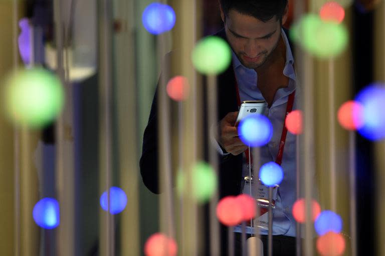 A visitor at the 2015 Mobile World Congress in Barcelona, where experts have warned of the dangers of sensitive health data on mobile phone ending up in the wrong hands