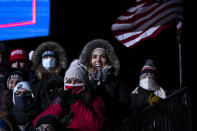 Supporters listen as President Donald Trump speaks at a campaign rally at Eppley Airfield, Tuesday, Oct. 27, 2020, in Omaha, Neb. (AP Photo/Evan Vucci)