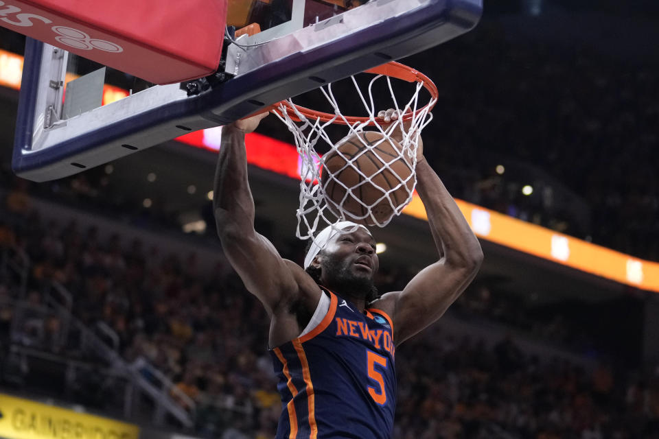 New York Knicks forward Precious Achiuwa (5) dunks the ball during the first half of Game 4 against the Indiana Pacers in an NBA basketball second-round playoff series, Sunday, May 12, 2024, in Indianapolis. (AP Photo/Michael Conroy)