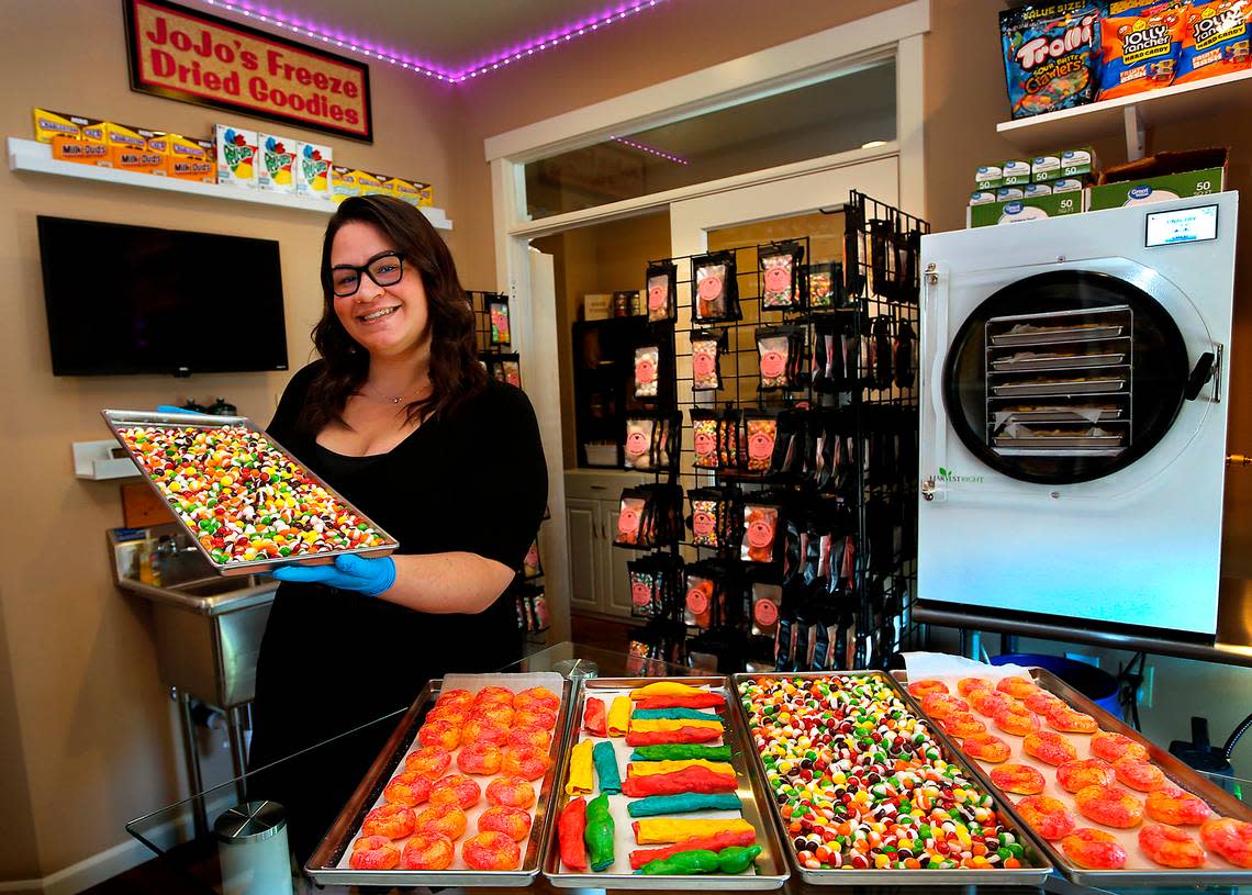 Sarra Hendrick, owner of JoJo’s Freeze Dried Goodies, holds a tray of finished candy that spent about 96 hours in a freeze drier in the licensed commercial kitchen she installed in her Pasco home.