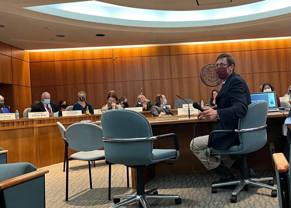 Nathan Small (D-Dona Aña) hands the microphone to a public commenter during a meeting of the House Appropriation Committee on Tuesday regarding $470 in federal money. The Legislature’s legal victory allowing members to allocate more than $1 billion in federal money came at a price for a program boosting chile farmer pay amid a labor shortage.