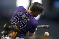 Colorado Rockies' Trevor Story hits against the Arizona Diamondbacks during the first inning of a baseball game Thursday, July 8, 2021, in Phoenix. (AP Photo/Darryl Webb)