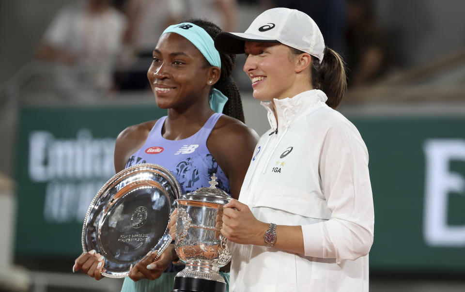 Coco Gauff and Iga Swiatek, pictured here with their trophies in the French Open post-match ceremony.