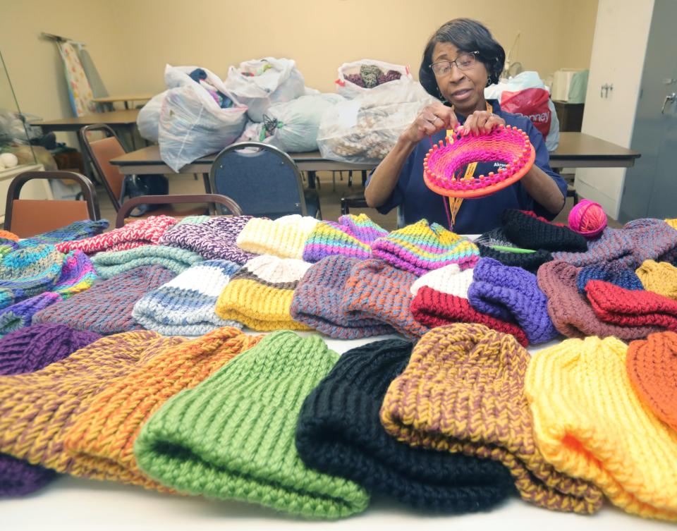 Akron Blind Center member Thressa Mae Brown, who is visually challenged, knits a winter hat to be distributed to those in need in the Akron area on Thursday, Dec. 22, 2022, in Akron.