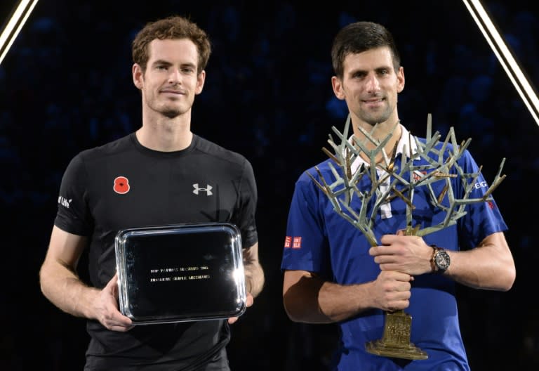 Novak Djokovic (R) convicingly swept away Andy Murray at last year's Paris Masters finals