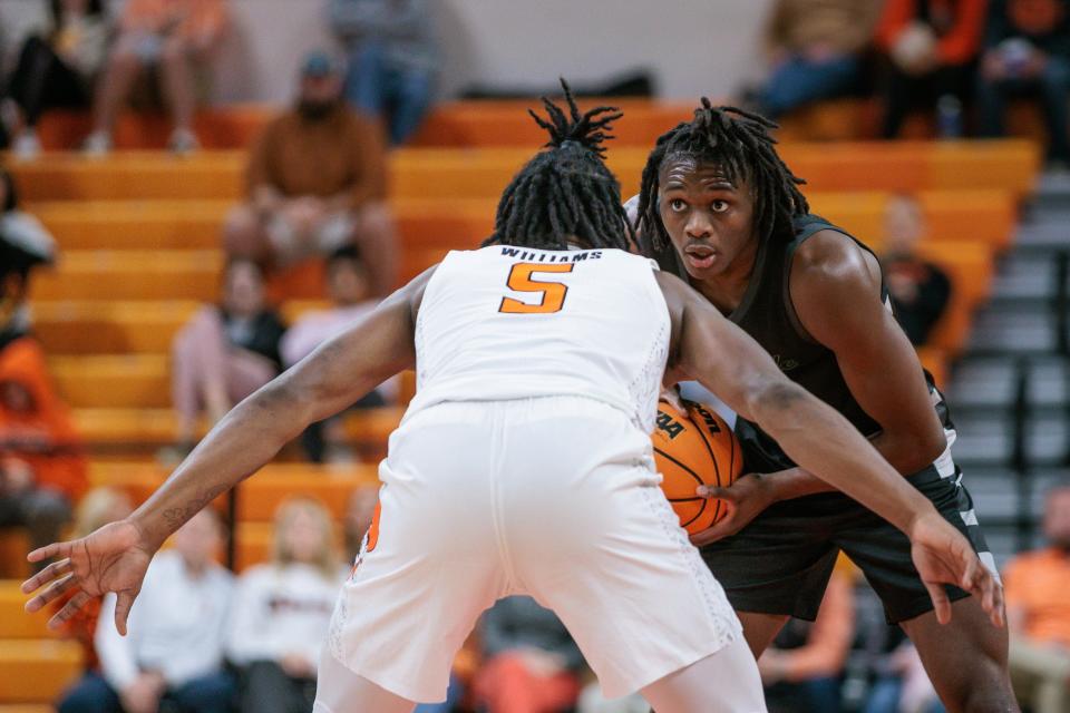 Chicago State guard Wesley Cardet Jr. faces off with Oklahoma State guard Quion Williams (5) on Jan. 3. Cardet has committed to Providence for the coming season.