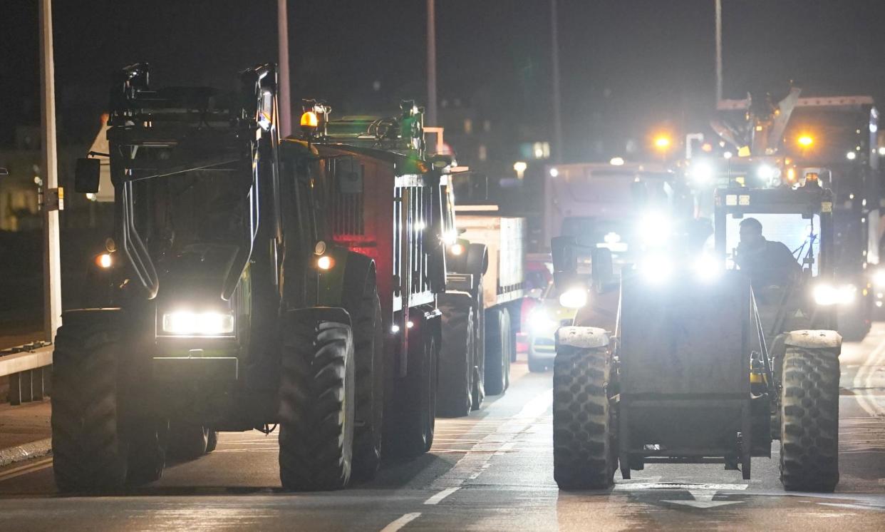 <span>Farmers slowed traffic on Friday near the port of Dover in Kent.</span><span>Photograph: Gareth Fuller/PA</span>