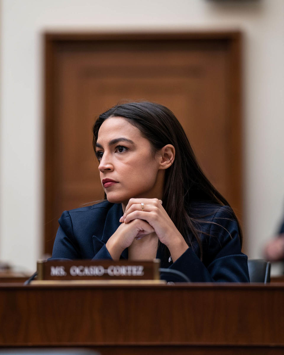 WASHINGTON, DC - DECEMBER 13: Rep. Alexandria Ocasio-Cortez (D-NY) listens as John J. Ray III, CEO of FTX Group, testifies before the House Financial Services Committee during a hearing titled Investigating the Collapse of FTX, Part I in the Rayburn House Office Building at the U.S. Capitol on Tuesday, Dec. 13, 2022 in Washington, DC. The US Securities and Exchange Commission charged disgraced cryptocurrency tycoon Sam Bankman-Fried on Tuesday with defrauding customers of billions of dollars. (Kent Nishimura / Los Angeles Times via Getty Images)