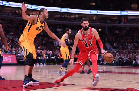 Dec 13, 2017; Chicago, IL, USA; Chicago Bulls forward Nikola Mirotic (44) dribbles the ball as Utah Jazz center Rudy Gobert (27) defends during the first half at the United Center. Mike DiNovo-USA TODAY Sports