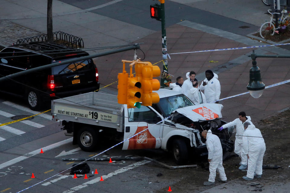 Investigators inspect the truck.