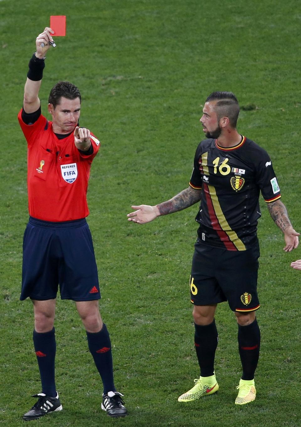 Referee Benjamin Williams of Australia shows Belgium's Steven Defour the red card during their 2014 World Cup Group H soccer match against South Korea at the Corinthians arena in Sao Paulo June 26, 2014. REUTERS/Paulo Whitaker