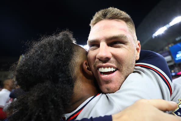 HOUSTON, TEXAS - NOVEMBER 02:  Freddie Freeman #5 and Ozzie Albies #1 of the Atlanta Braves celebrate the team's 7-0 victory against the Houston Astros in Game Six to win the 2021 World Series at Minute Maid Park on November 02, 2021 in Houston, Texas. (Photo by Carmen Mandato/Getty Images)