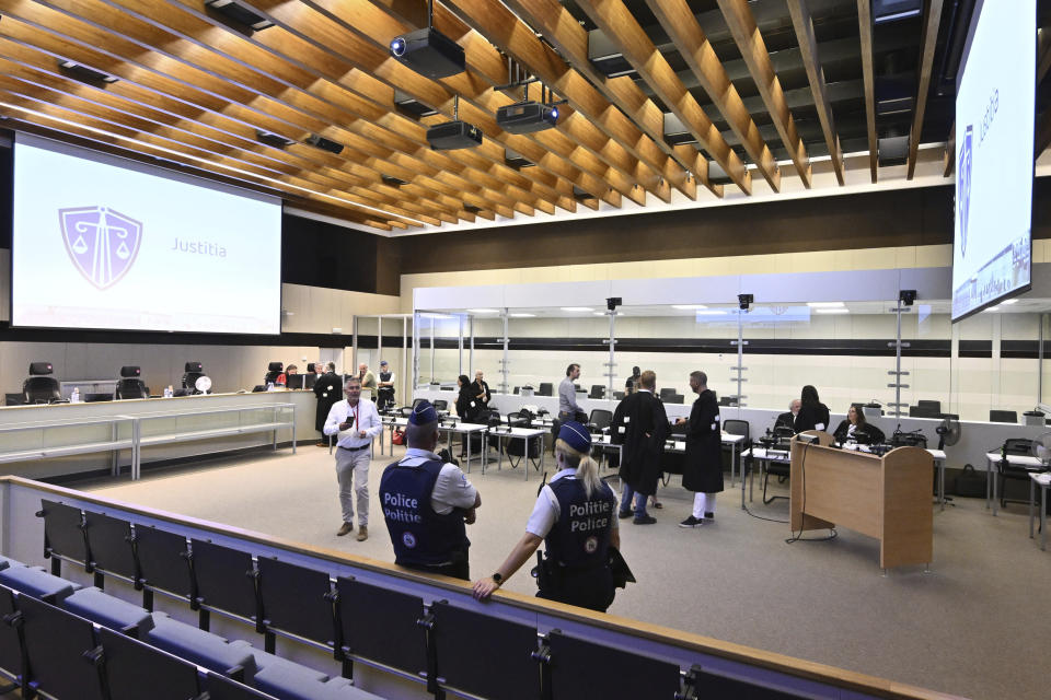 Lawyers attend the courtroom prior to the reading of the sentences during the trial regarding the attacks at a Brussels metro station and the city's airport at the Justitia building in Brussels, Friday, Sept. 15, 2023. The morning rush hour attacks at Belgium's main airport and on the central commuter line took place on March 22, 2016, which killed 32 people, and nearly 900 others were wounded or suffered mental trauma. (John Thys, Pool Photo via AP)