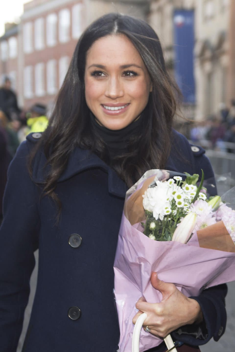 Meghan with a posy of flowers because she deserves all the damn flowers. Source: Getty