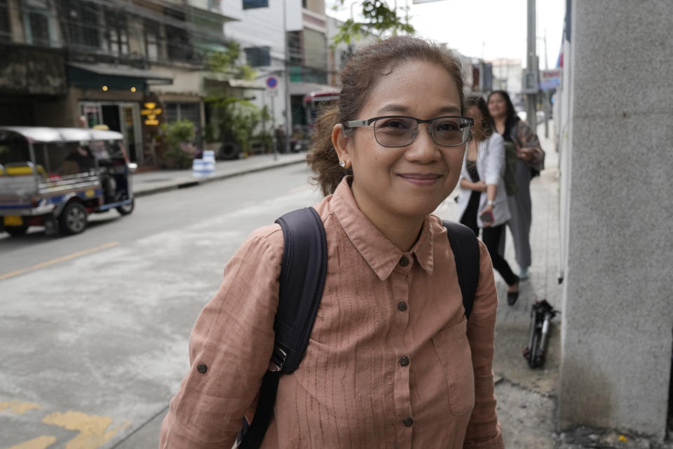 Puttanee Kangkun arrives at Southern Criminal Court in Bangkok, Thailand, Tuesday, Aug. 29, 2023. Three human rights activists including Puttanee were acquitted Tuesday of criminally defaming a Thai poultry company with social media posts that supported activists who accused the company of abusive labor practices, according to three defendants and their lawyer. (AP Photo/Sakchai Lalit)