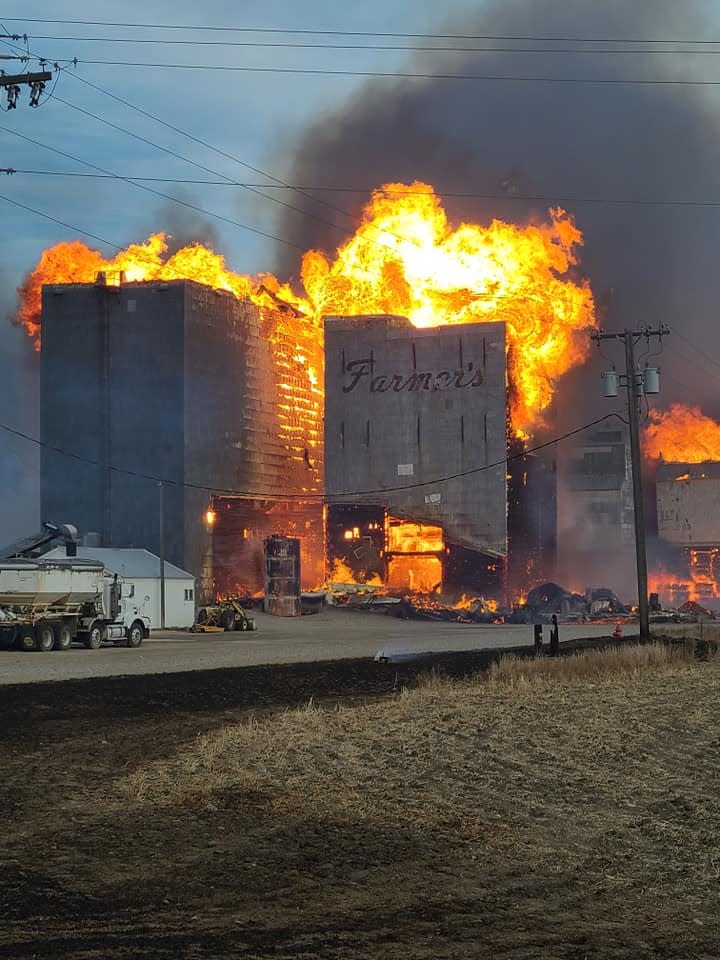 Denton grain elevators are fully engulfed by flames at the height of the West Wind Fire.