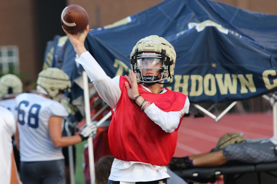 Independence High junior quarterback Cody Pagach warms up on the sidelines just before the start of his team's scrimmage against Montgomery Bell Academy Friday, July 29, 2022 at MBA in Nashville.