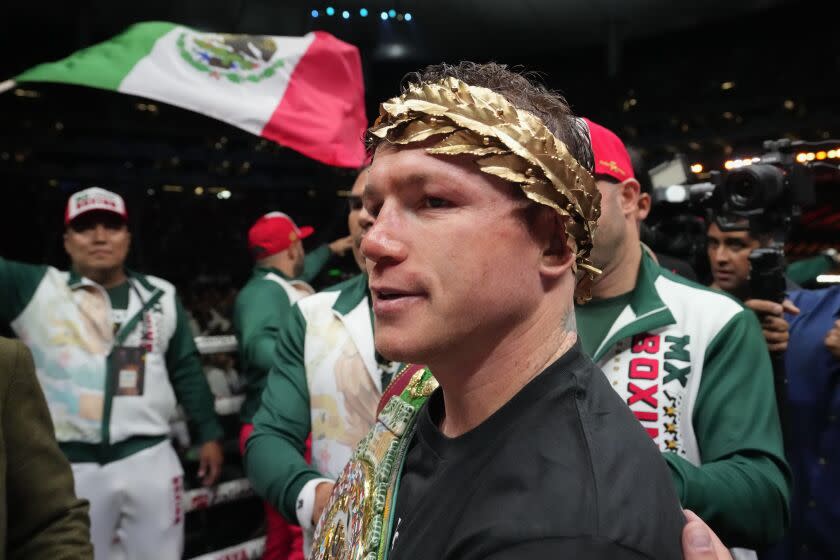 Saul "Canelo" Alvarez of Mexico celebrates after defeating John Ryder of Britain in their super middleweight title boxing match at the Akron Stadium in Guadalajara, Mexico, Saturday, May 6, 2023. (AP Photo/Moises Castillo)