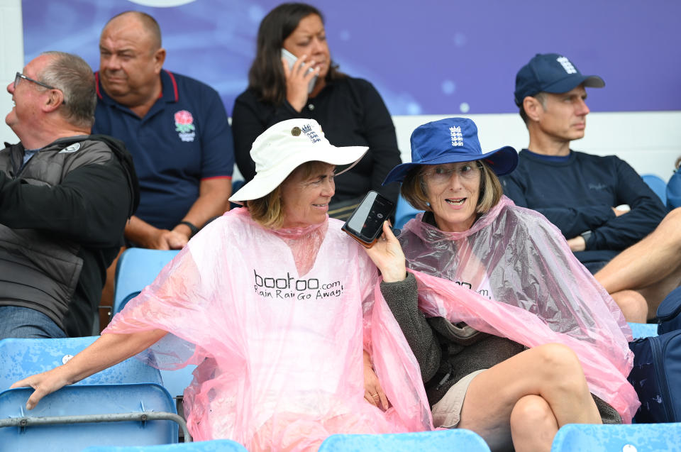 LEEDS, ENGLAND - JULY 08: Cricket fans wait for the rain to end during day three of the LV= Insurance Ashes 3rd Test Match between England and Australia at Headingley on July 08, 2023 in Leeds, England.  (Photo by Stu Forster - ECB/ECB via Getty Images)
