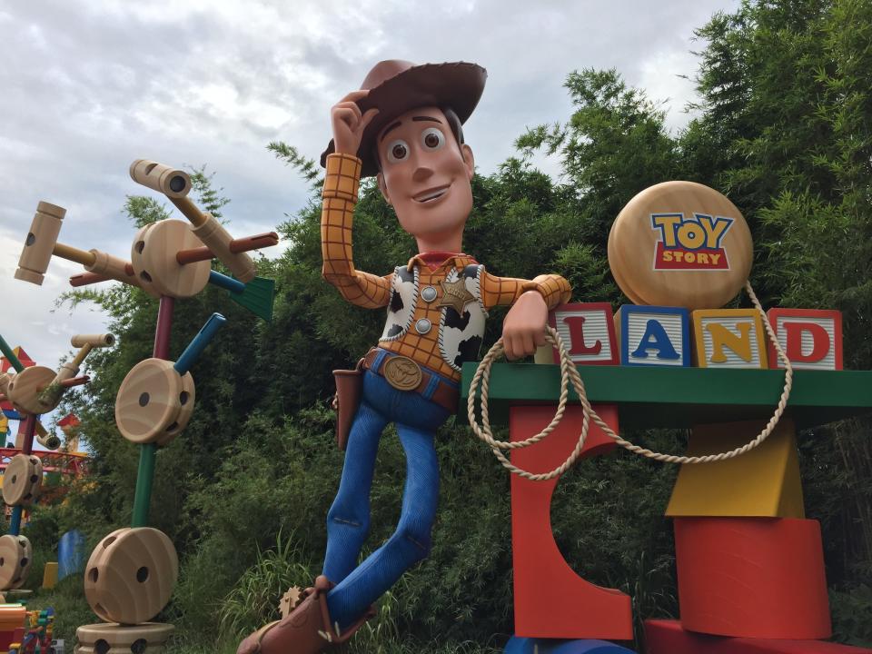 A 20-foot-tall Sheriff Woody tips his hat&nbsp;to visitors at Toy Story Land at Disney's Hollywood Studios in Florida.