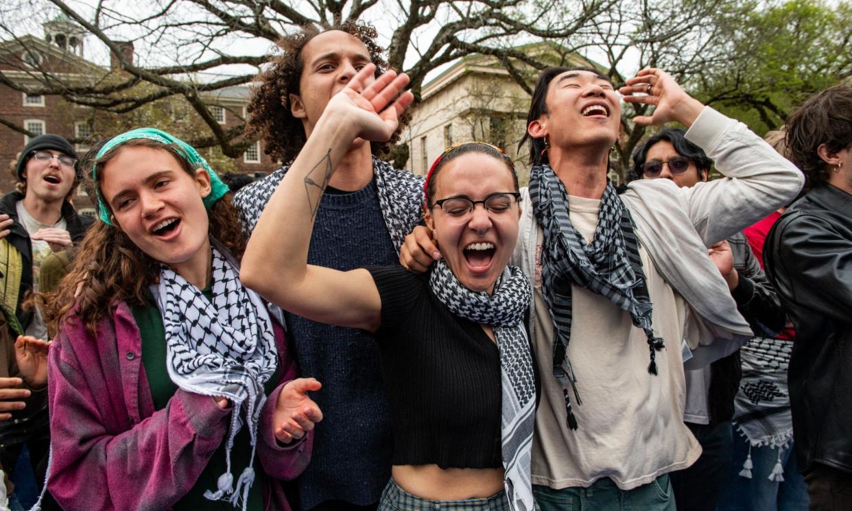 <span>Students celebrate reaching a deal with Brown University, in Providence, Rhode Island, on 30 April 2024.</span><span>Photograph: Joseph Prezioso/AFP/Getty Images</span>