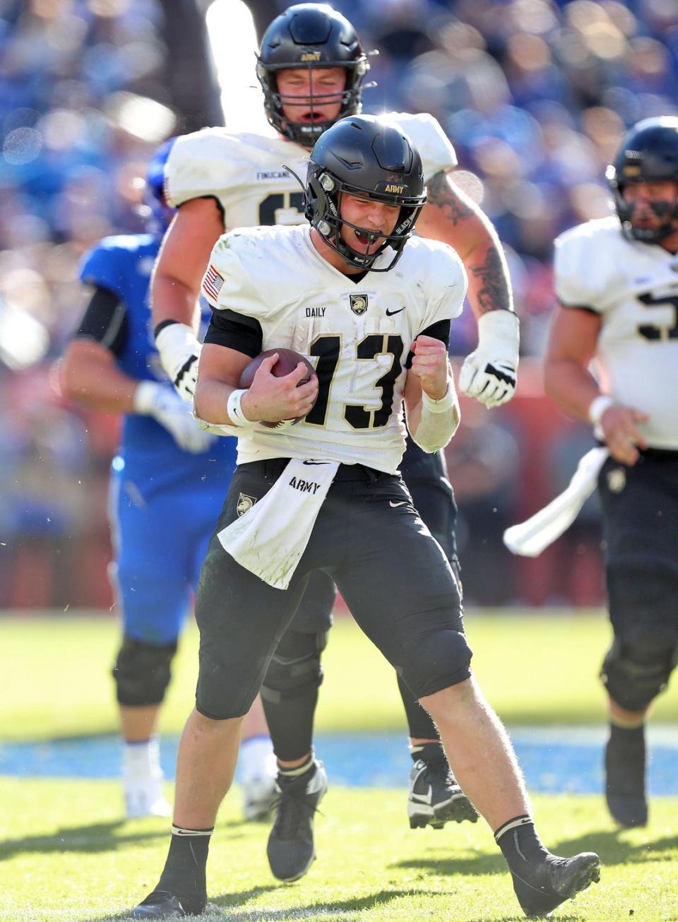 Nov 4, 2023; Denver, Colorado, USA; Army Black Knights quarterback Bryson Daily (13) celebrates after picking up a first down against the Air Force Falcons during the second half at Empower Field at Mile High. Mandatory Credit: Danny Wild-USA TODAY Sports