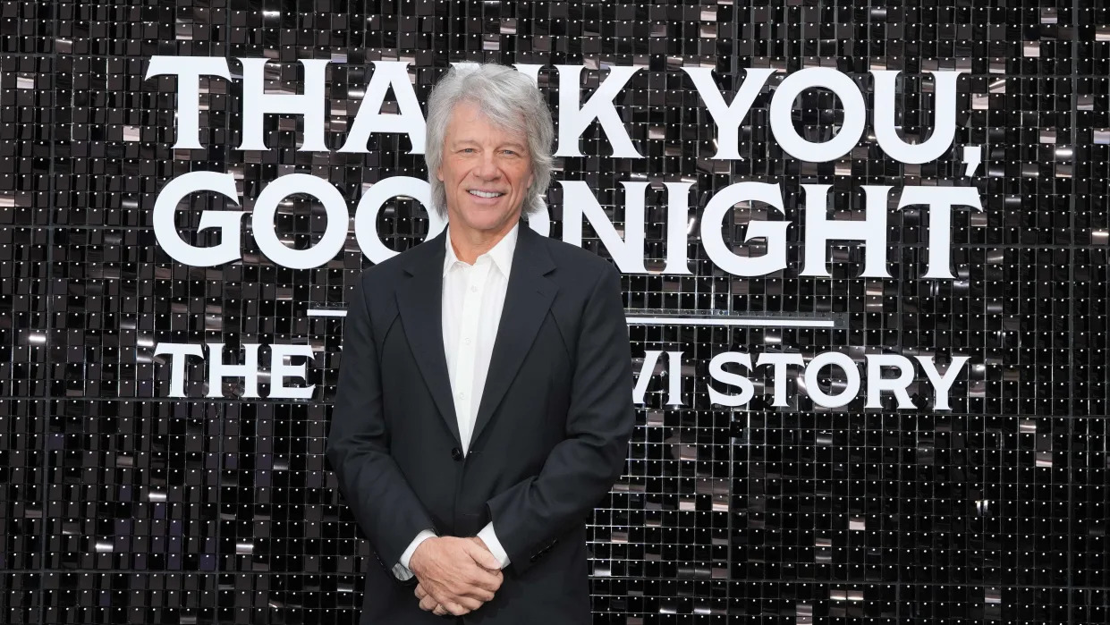 Jon Bon Jovi, in black suit and white open-collar shirt, at the U.K. premiere of Disney+ series 