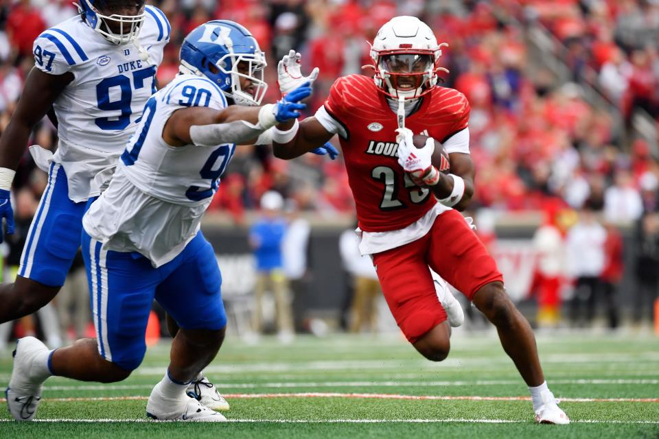 Duke's DeWayne Carter tries to wrap up Louisville's Jawhar Jordan during their game Sept. 28.