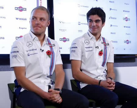 The newly announced Williams Martini Racing driver for the 2017 season Lance Stroll (R) and team-mate Valteri Bottas attend a media conference at their base in Wantage, Britain November 3, 2016. REUTERS/Eddie Keogh