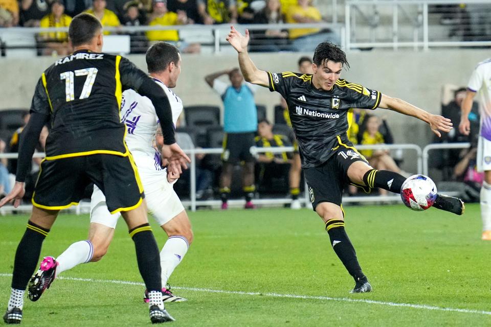 Crew midfielder Isaiah Parente makes a shot attempt while defended by Orlando's Kyle Smith on Saturday.